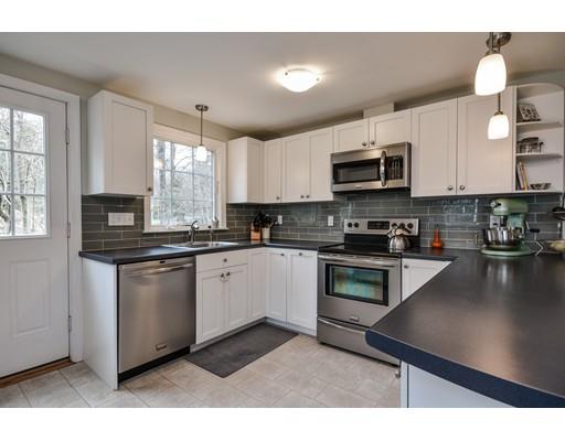 897 Salem End Road Framingham, MA 01702 - Photo 12 of 27 a kitchen with stainless steel appliances a stove a sink a microwave a refrigerator and cabinets