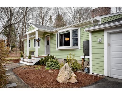 897 Salem End Road Framingham, MA 01702 - Photo 2 of 27 a view of a backyard with table and chairs and wooden fence
