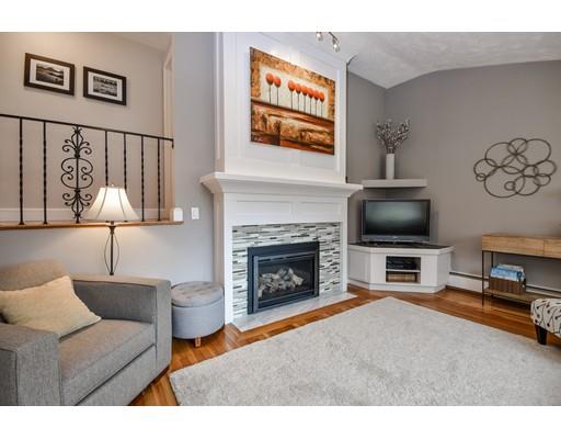 897 Salem End Road Framingham, MA 01702 - Photo 4 of 27 a living room with furniture and a fireplace