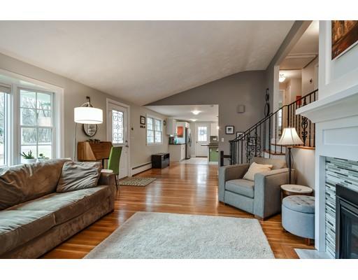 897 Salem End Road Framingham, MA 01702 - Photo 5 of 27 a living room with fireplace furniture and a large window