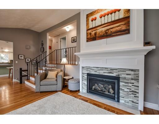 897 Salem End Road Framingham, MA 01702 - Photo 6 of 27 a living room with furniture and a fireplace