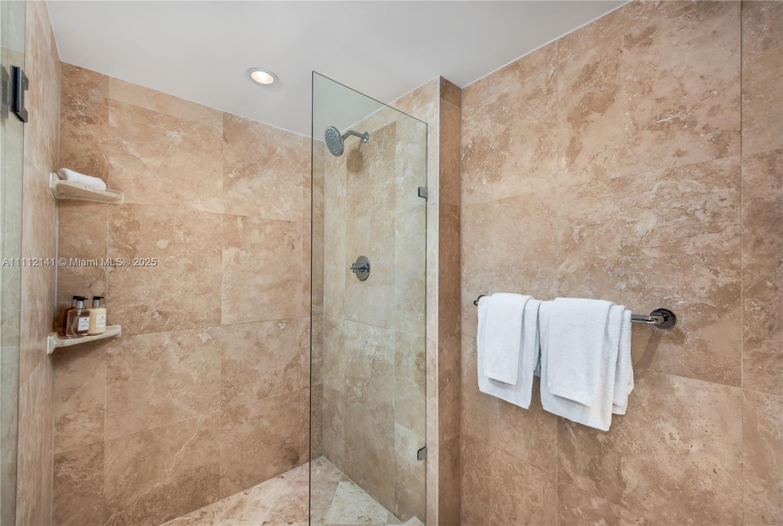 102 24th Street, Unit 1208 Miami Beach, FL 33139 - Photo 7 of 19 a bathroom with a shower and a tub