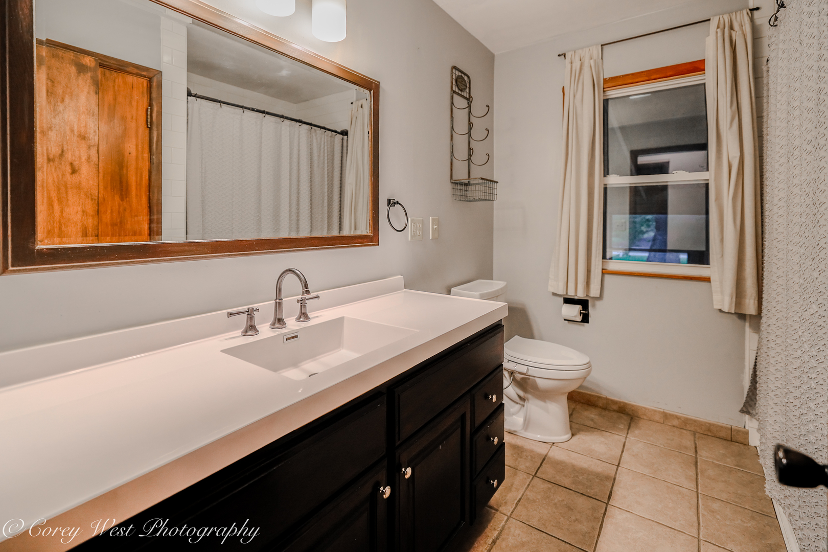 8994 Highway 64 Sycamore, IL 60178 - Photo 14 of 37 a bathroom with a sink a toilet and a mirror