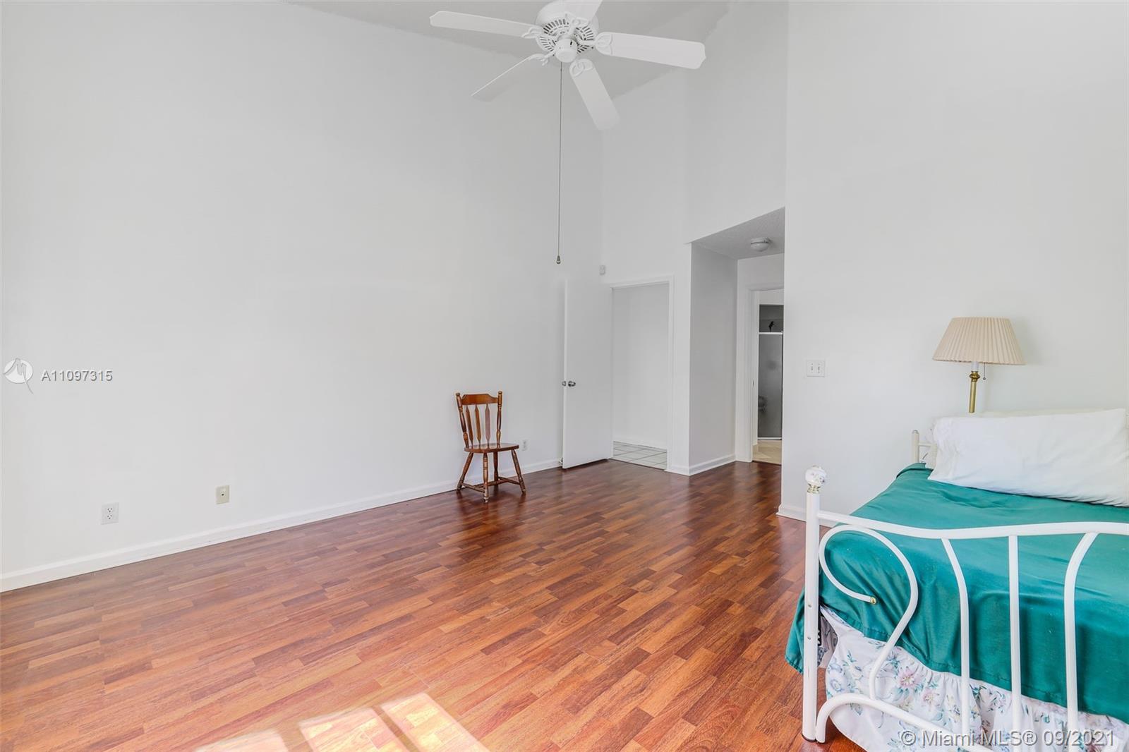 5140 Northwest 5th Avenue Boca Raton, FL 33487 - Photo 21 of 44 a bedroom with a bed and a window