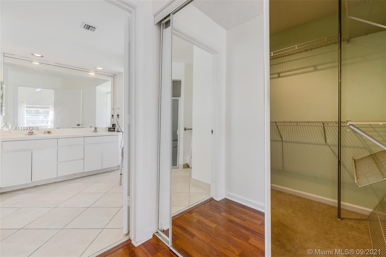 5140 Northwest 5th Avenue Boca Raton, FL 33487 - Photo 22 of 44 a bathroom with a sink and a mirror