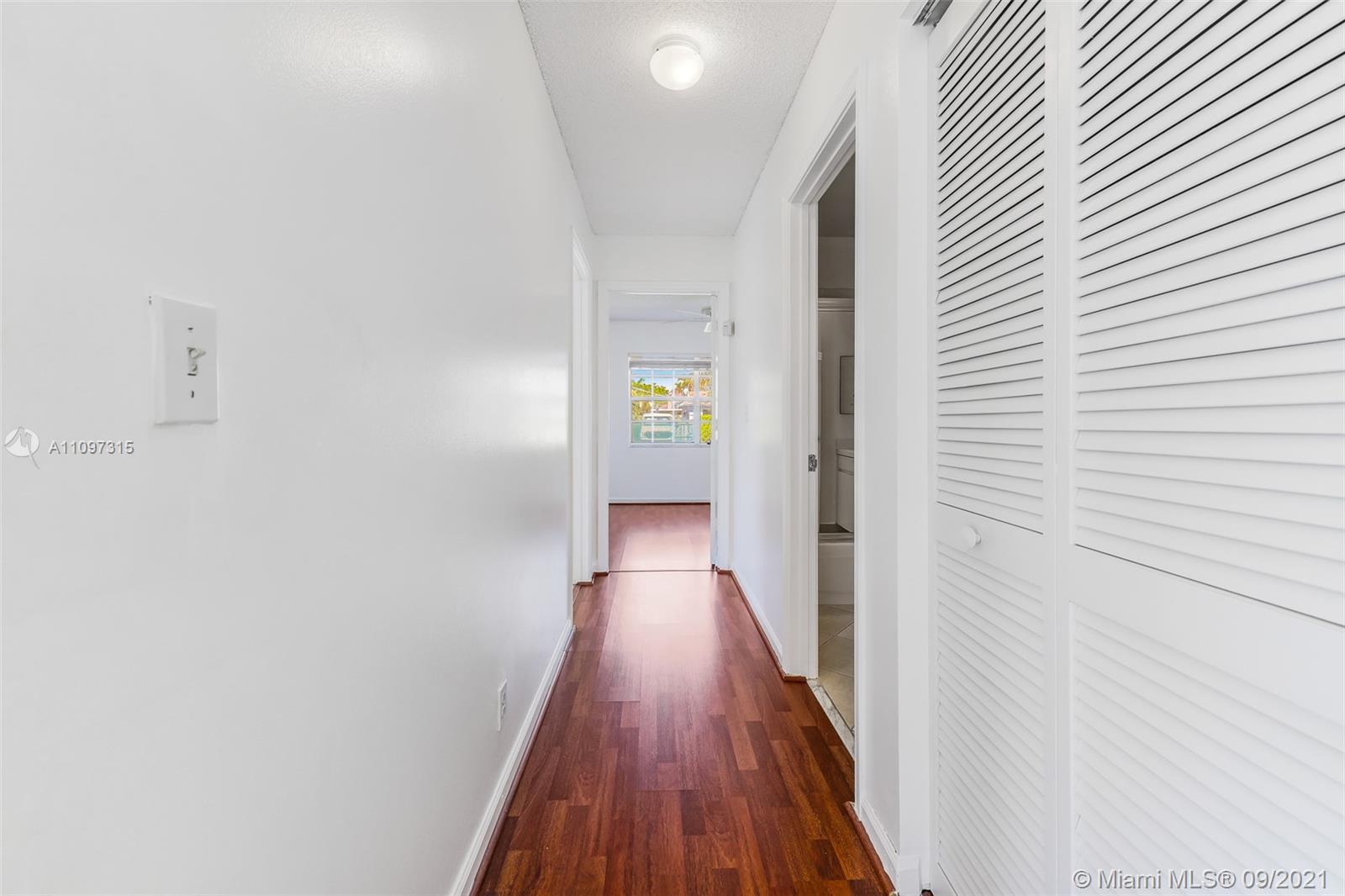 5140 Northwest 5th Avenue Boca Raton, FL 33487 - Photo 25 of 44 a view of a hallway with wooden floor