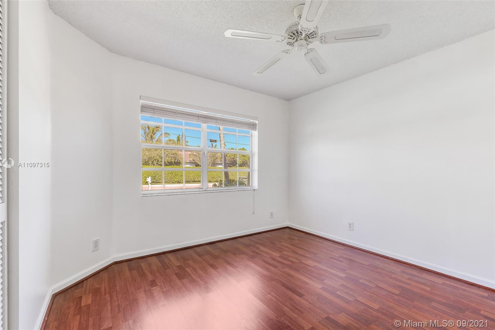 5140 Northwest 5th Avenue Boca Raton, FL 33487 - Photo 28 of 44 an empty room with a window and a ceiling fan