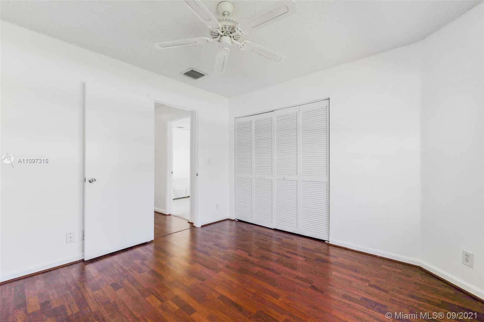 5140 Northwest 5th Avenue Boca Raton, FL 33487 - Photo 29 of 44 a view of an empty room with wooden floor