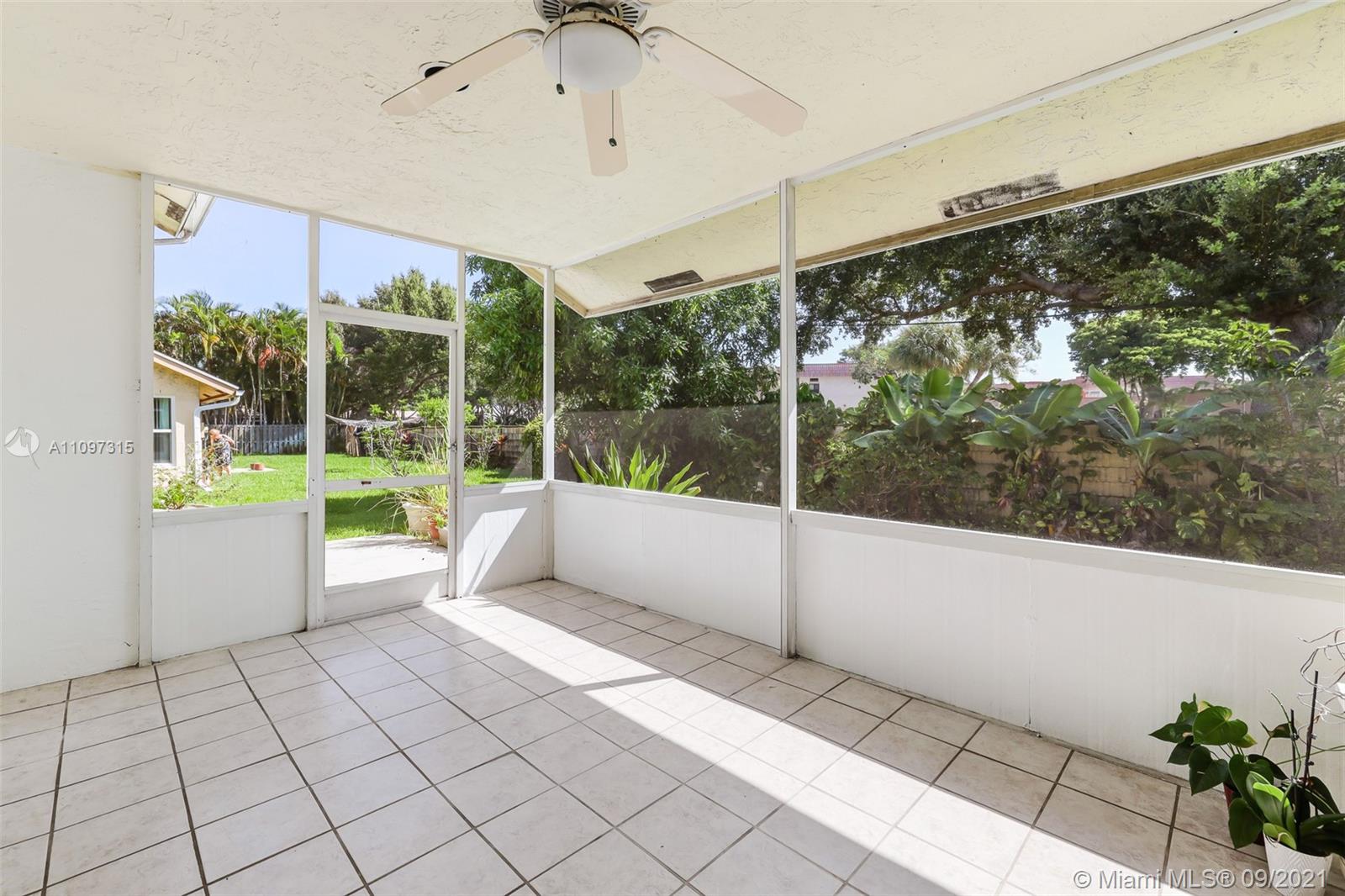 5140 Northwest 5th Avenue Boca Raton, FL 33487 - Photo 31 of 44 a living room with a large window