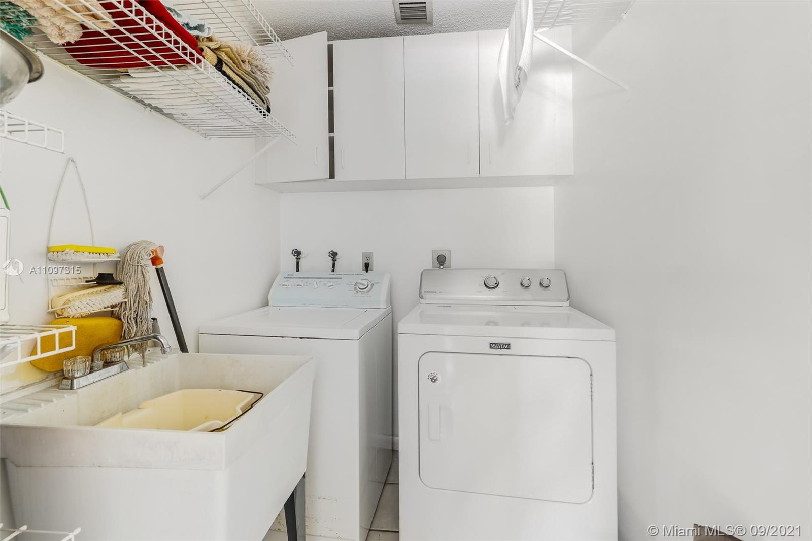 5140 Northwest 5th Avenue Boca Raton, FL 33487 - Photo 43 of 44 a utility room with dryer and washer