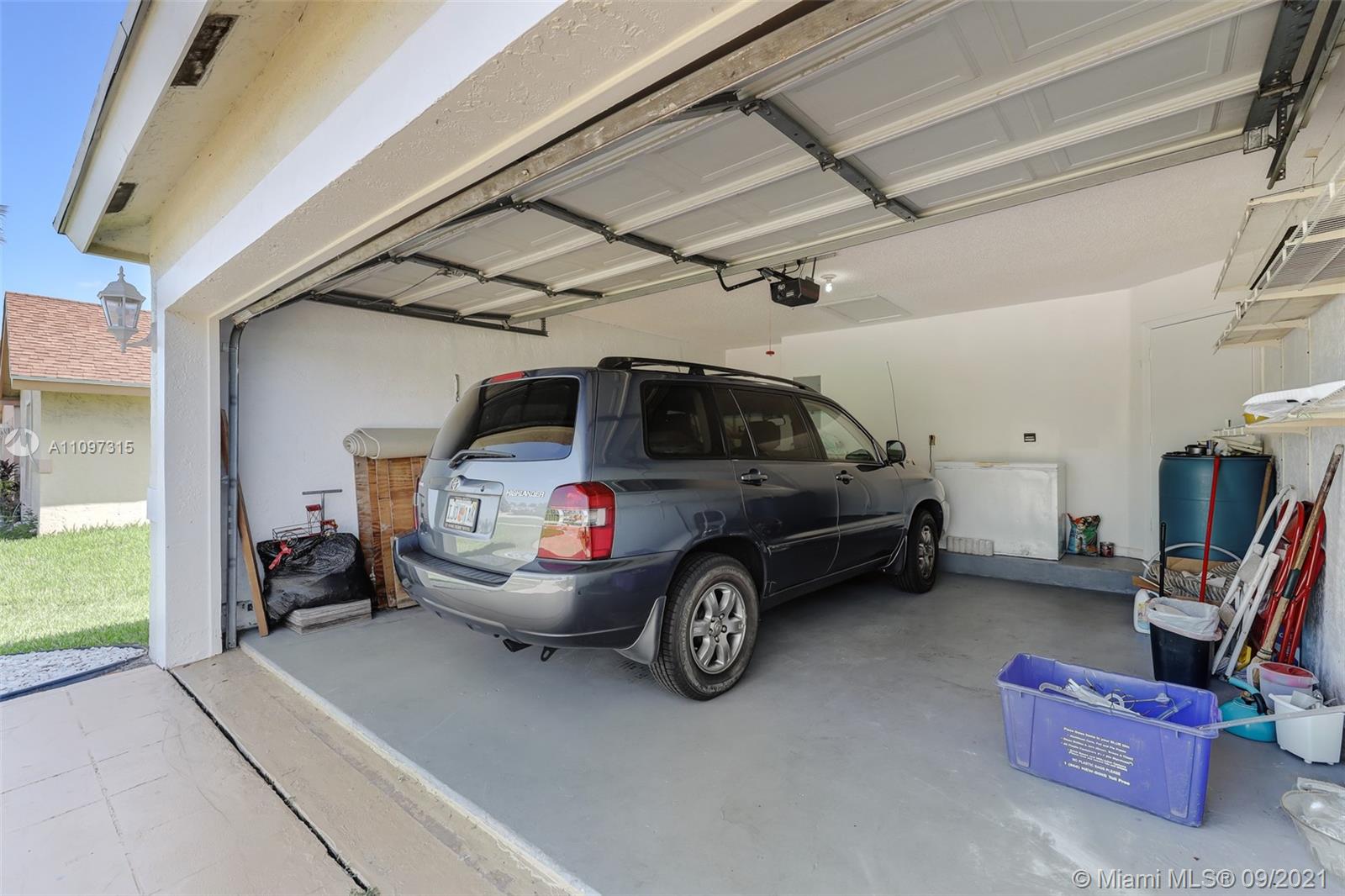 5140 Northwest 5th Avenue Boca Raton, FL 33487 - Photo 44 of 44 a view of a garage with parked cars