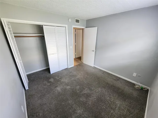 a bathroom with a toilet a sink a tub and mirror