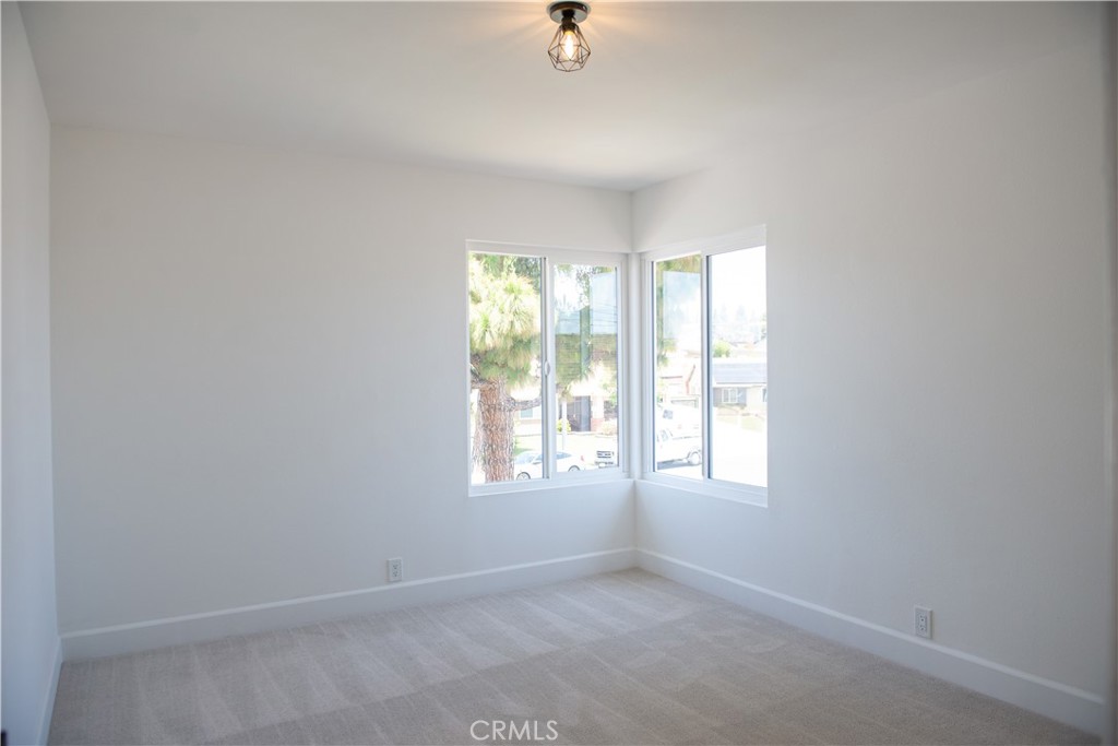 1466 East Helmick Street Carson, CA 90746 - Photo 29 of 32 an empty room with windows