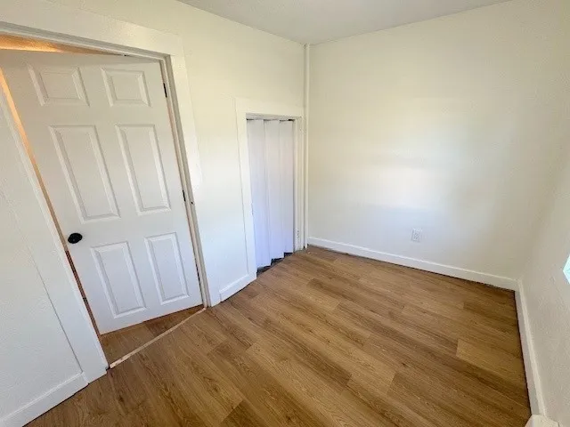 an empty room with a wooden door
