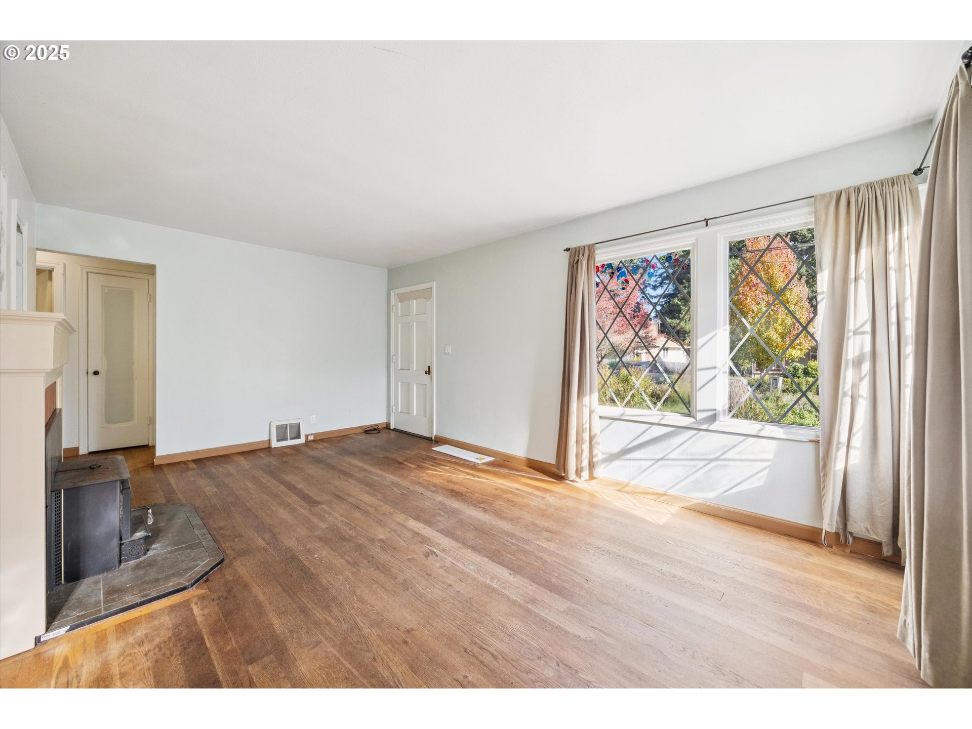 1115 Northeast 106th Avenue Portland, OR 97220 - Photo 13 of 46 wooden floor in an empty room with a window