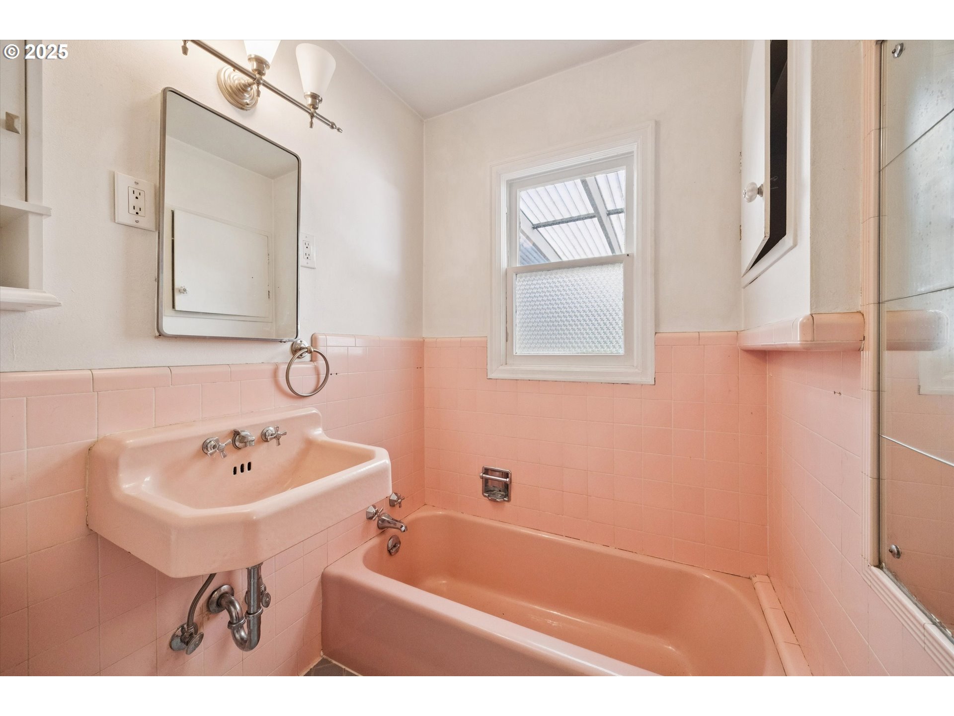 1115 Northeast 106th Avenue Portland, OR 97220 - Photo 22 of 46 a bathroom with a sink a bathtub and a mirror