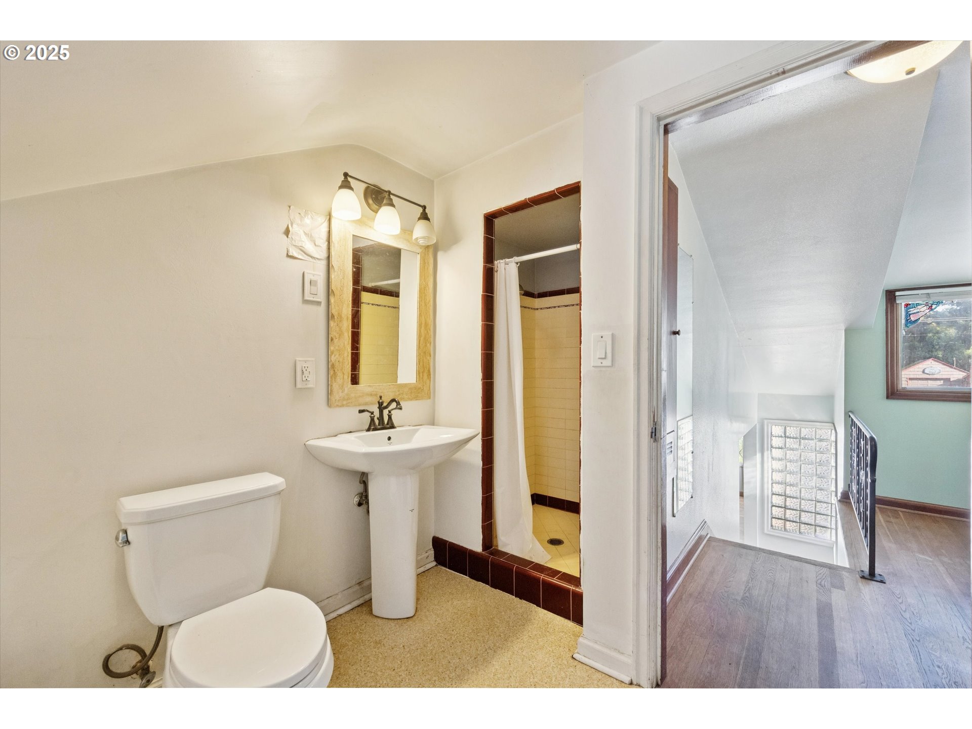 1115 Northeast 106th Avenue Portland, OR 97220 - Photo 28 of 46 a bathroom with a toilet sink and mirror