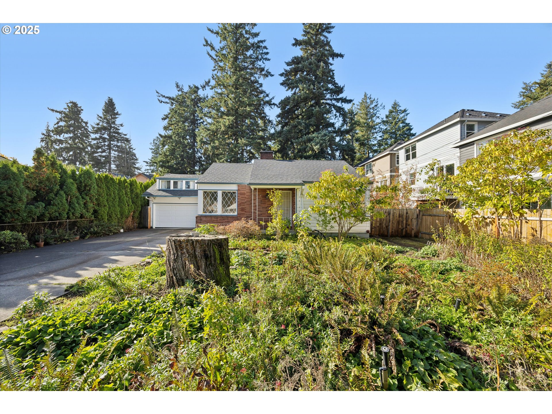 1115 Northeast 106th Avenue Portland, OR 97220 - Photo 6 of 46 a backyard of a house with table and chairs plants and large trees