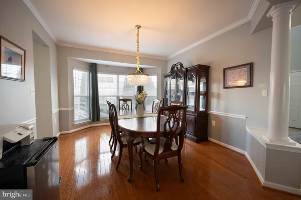 a kitchen with stainless steel appliances kitchen island granite countertop a stove top oven a sink a counter top space and cabinets