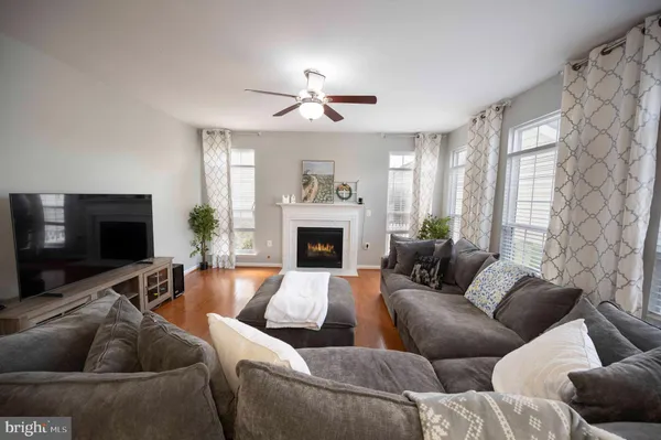 a kitchen with stainless steel appliances granite countertop a refrigerator stove top oven and sink
