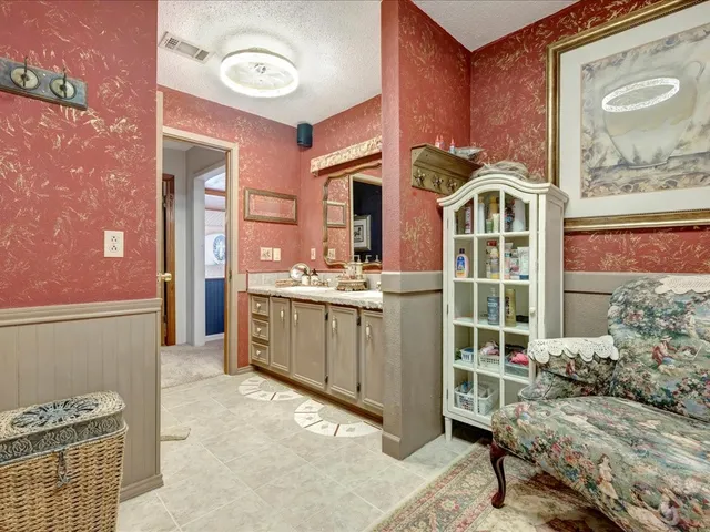 a view of a hallway with entryway and front door