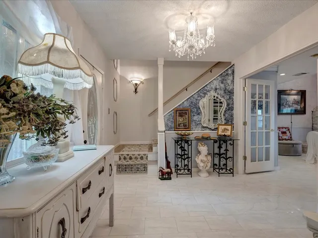 a view of hall way with furniture