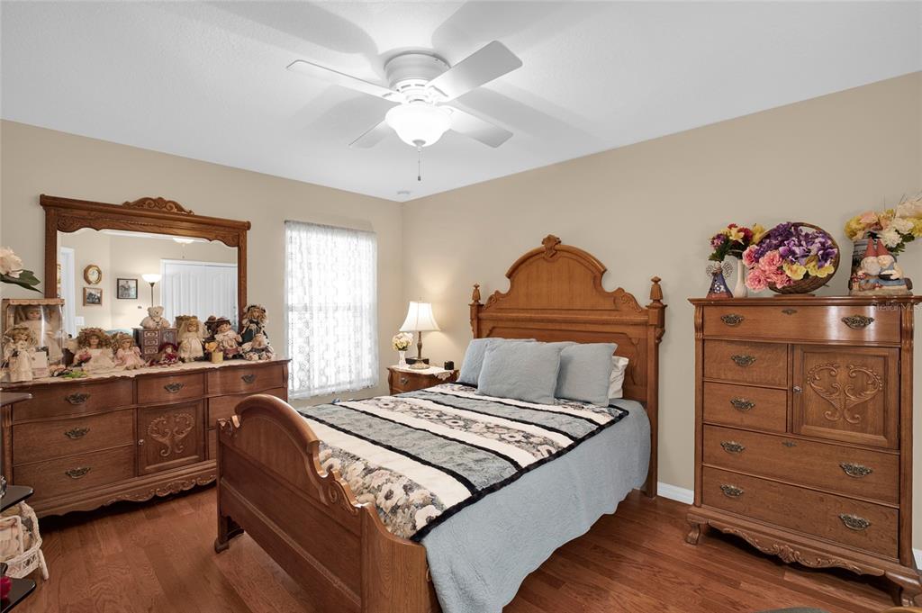 16411 Southwest 14th Avenue Road Ocala, FL 34473 - Photo 23 of 59 a bedroom with a bed and a dresser in it