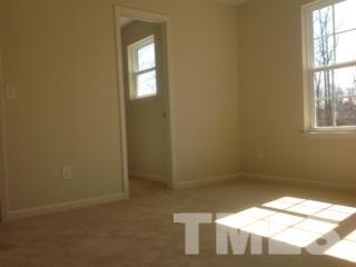 6805 Planting Court Raleigh, NC 27610 - Photo 3 of 14 a view of empty room with windows
