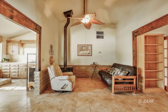 548 East Laura Avenue Ridgecrest, CA 93555 - Photo 22 of 34 a living room with furniture and a couch
