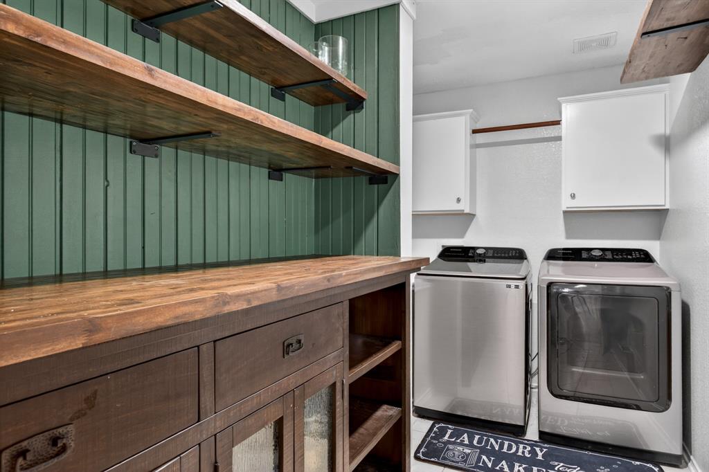 2864 Deer Ridge Drive Rockwall, TX 75032 - Photo 23 of 39 custom pantry shelves leading to laundry room