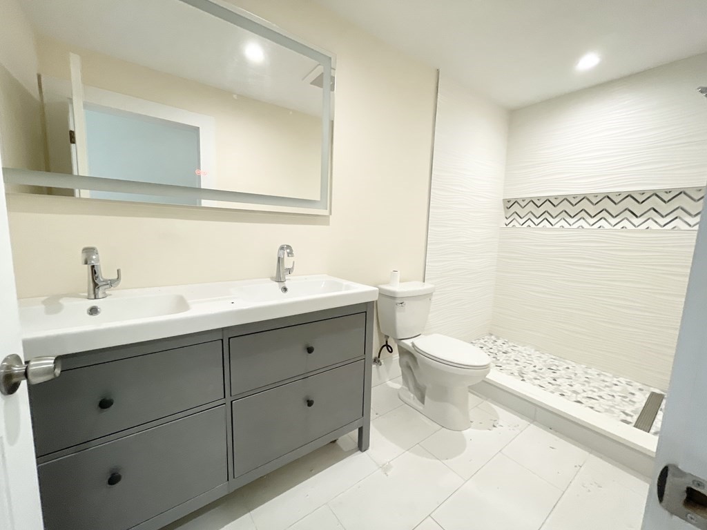 72 Roseclair Street, Unit 2 Boston, MA 02125 - Photo 13 of 14 a bathroom with a double vanity sink mirror and toilet