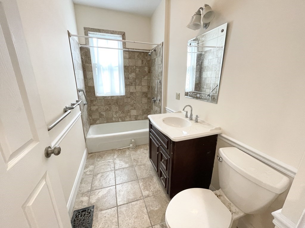 72 Roseclair Street, Unit 2 Boston, MA 02125 - Photo 14 of 14 a bathroom with a sink a toilet and bathtub