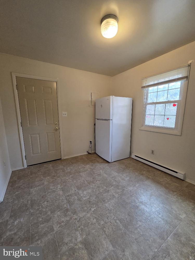 10408 Leavells Road Fredericksburg, VA 22407 - Photo 3 of 10 an empty room with windows