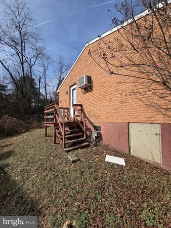 a view of a backyard with wooden fence