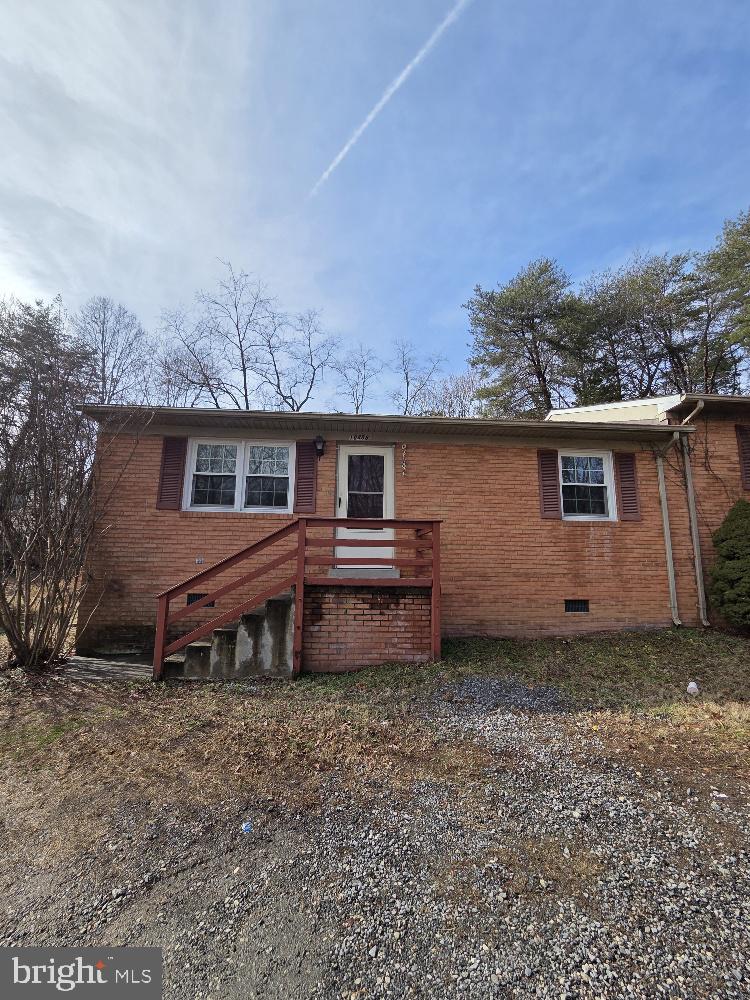 10408 Leavells Road Fredericksburg, VA 22407 - Photo 10 of 10 front view of a house with a house and a yard
