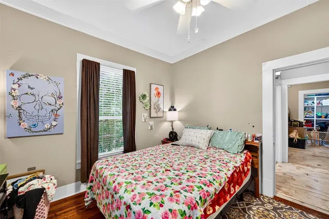 a bedroom with a bed and a chandelier