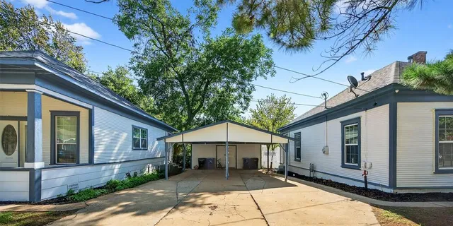a patio with table and chairs