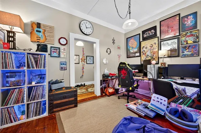 a room with furniture and book shelf