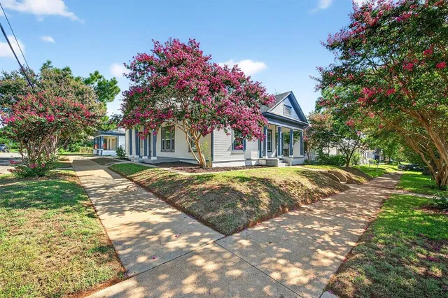 a house with trees in front of it