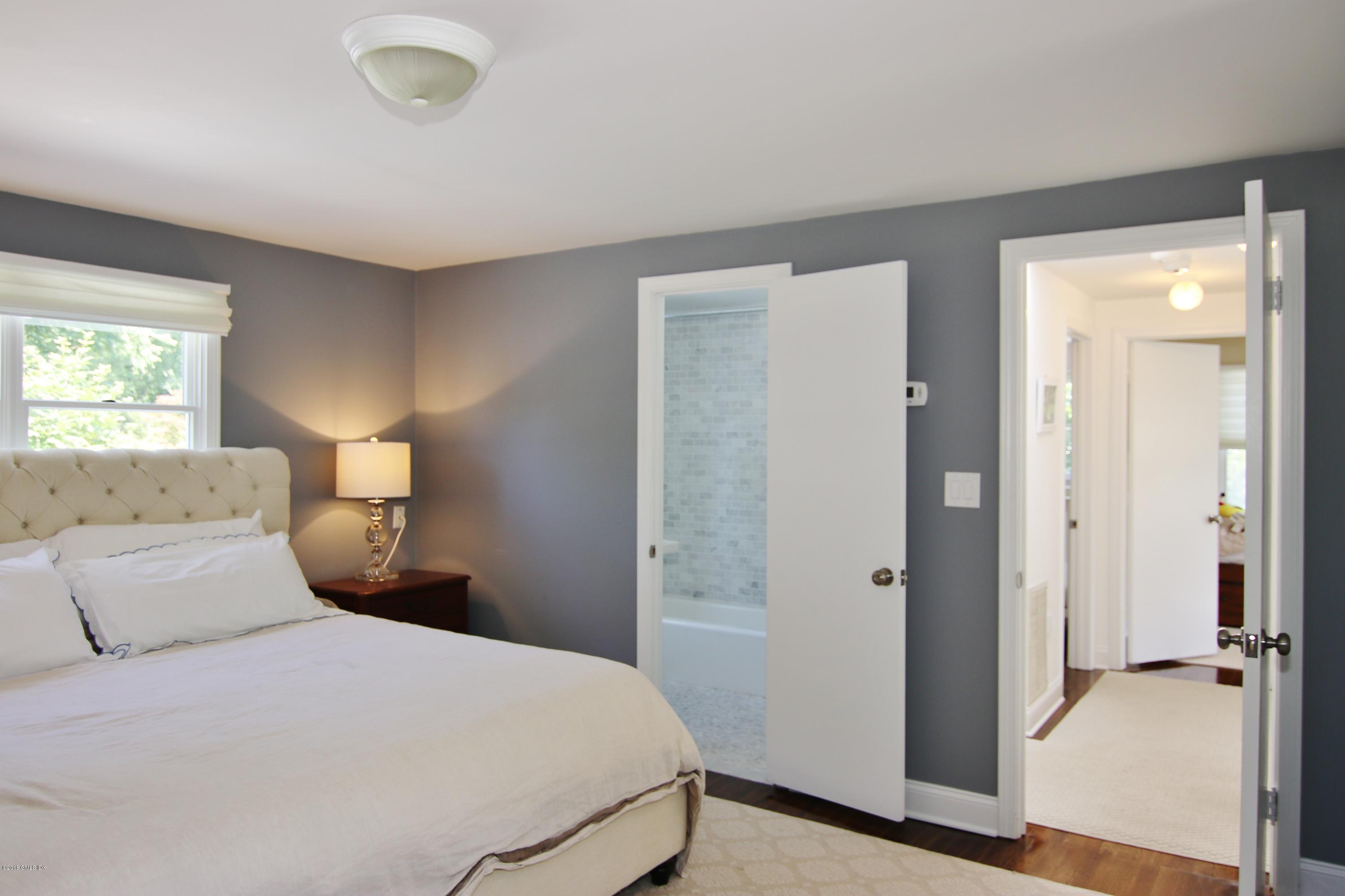 9 Bonwit Road Riverside, CT 06878 - Photo 17 of 29 a bedroom with a bed and a table