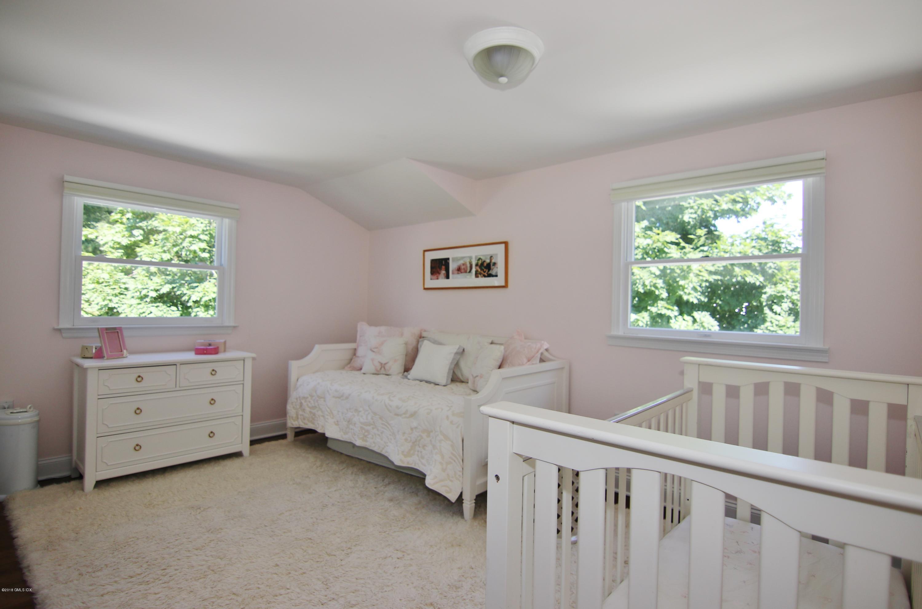 9 Bonwit Road Riverside, CT 06878 - Photo 19 of 29 a room with a baby bed baby crib and a window