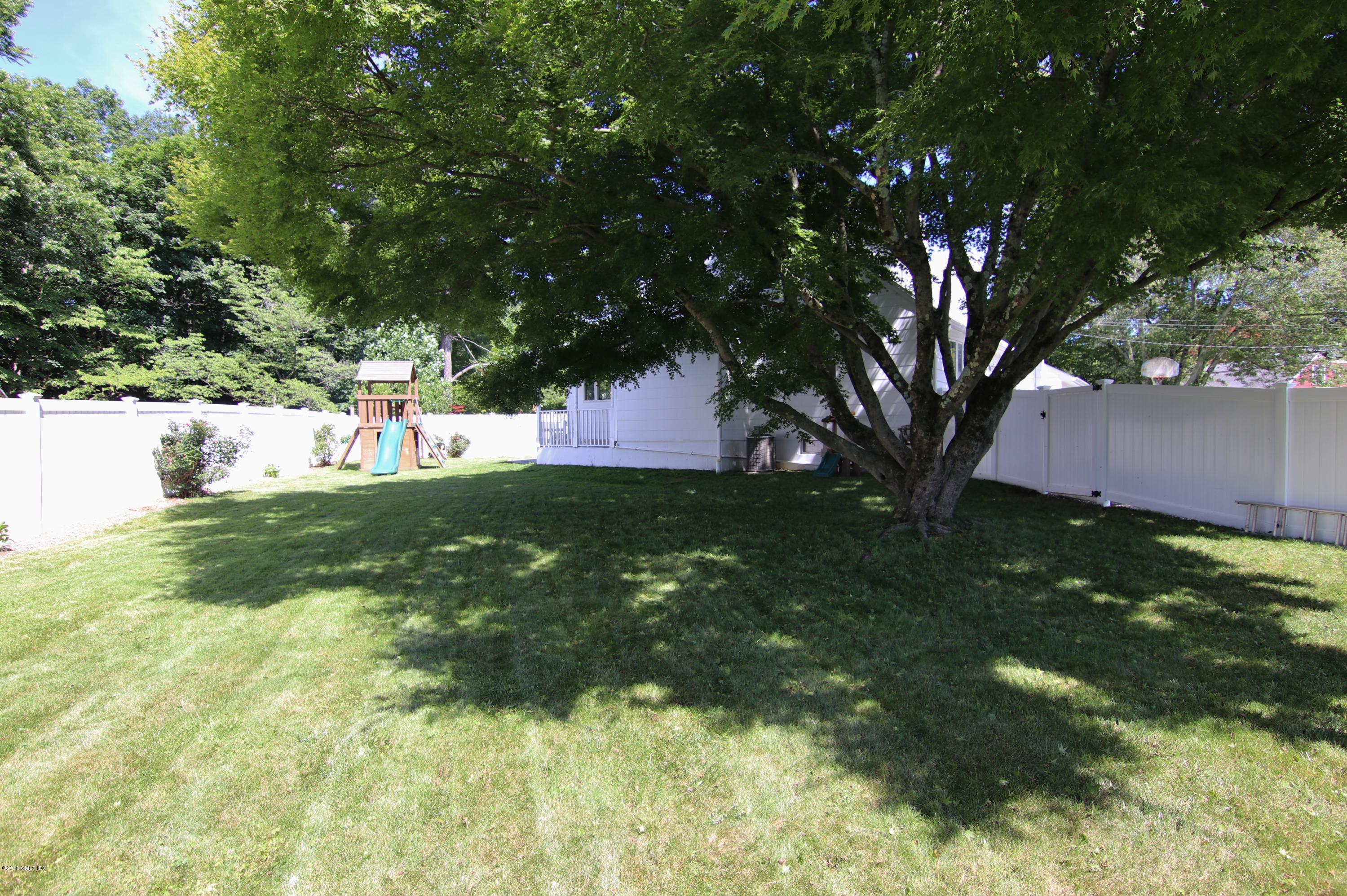 9 Bonwit Road Riverside, CT 06878 - Photo 27 of 29 a backyard of a house with lots of green space
