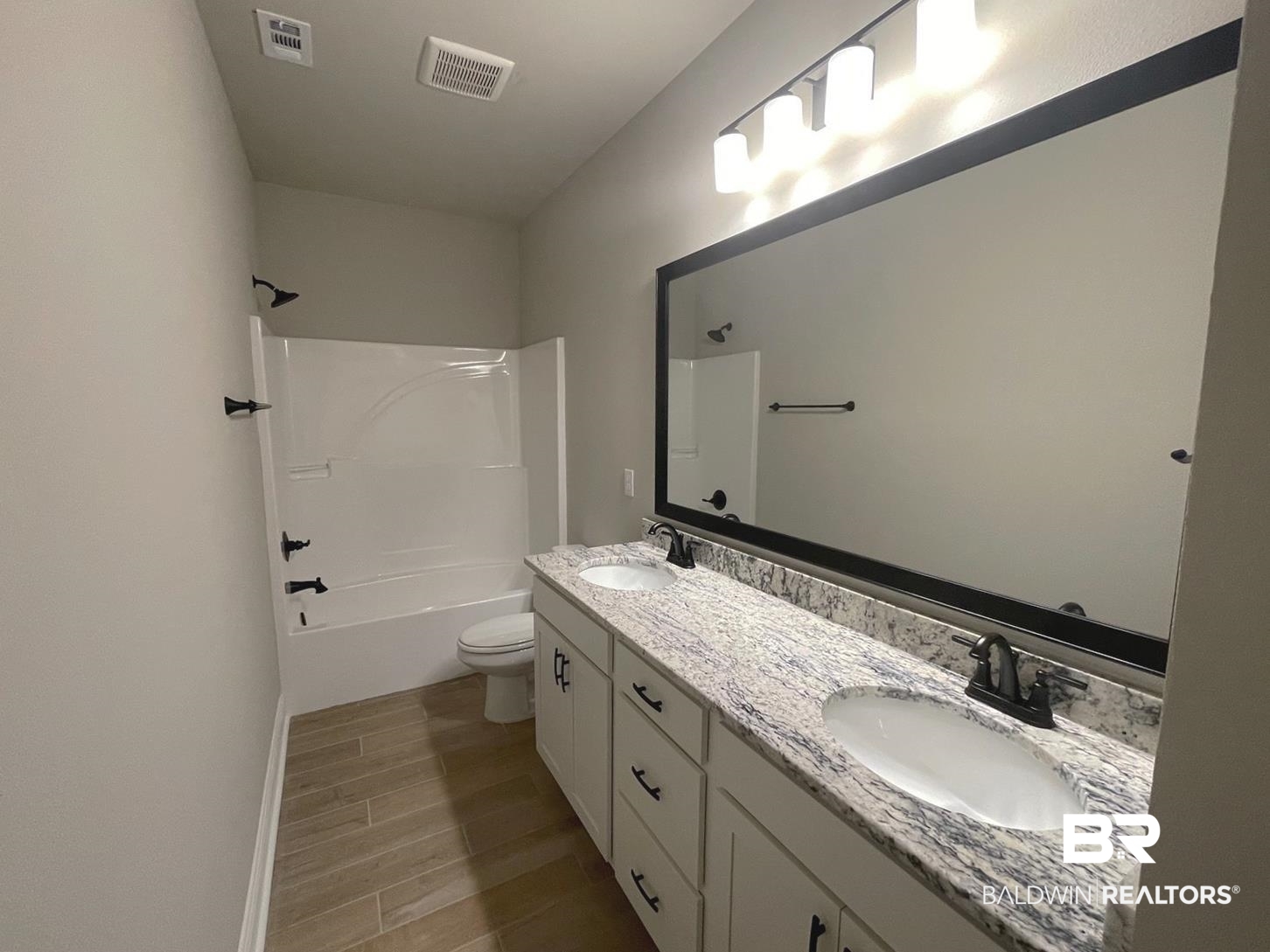 1412 Fenton Circle Foley, AL 36535 - Photo 11 of 15 Full bathroom with toilet, vanity, and bathtub / shower combination