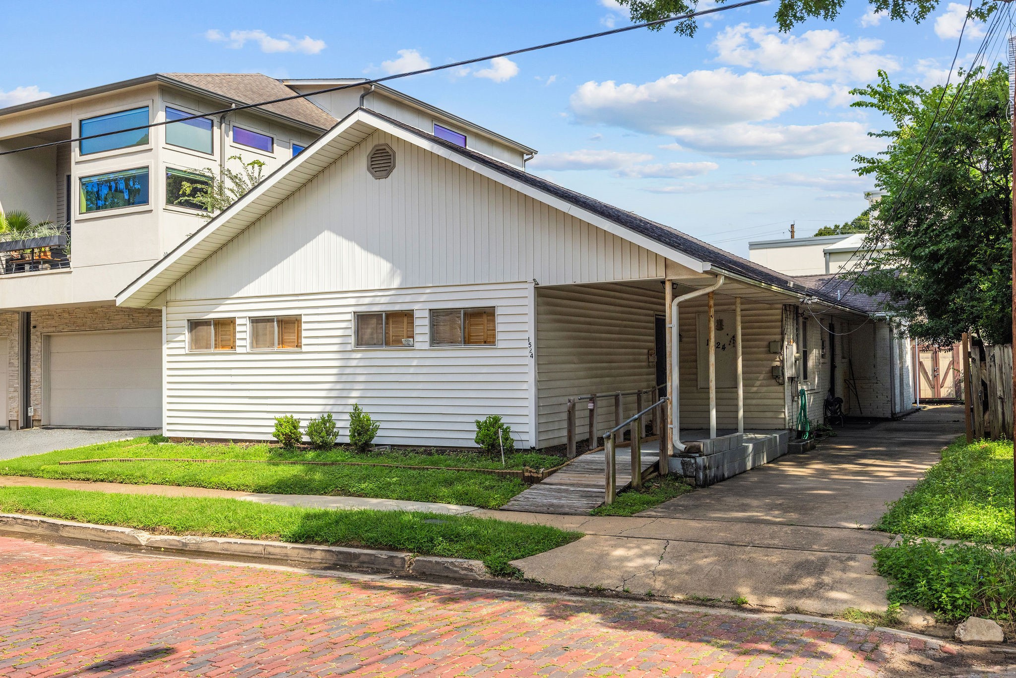 1524 Michigan Street Houston, TX 77006 - Photo 5 of 10 Front of current structure located on one of Hyde Park's iconic brick-lined streets. Existing structure conveys at lot value.