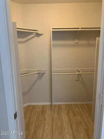 a view of an empty walk in closet
