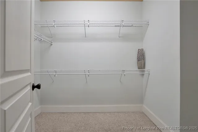 a backyard of a building with large trees