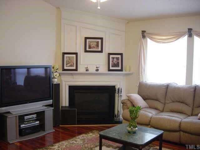 116 Saddle River Road Apex, NC 27502 - Photo 2 of 10 The focal point to this spacious family room is the cozy fireplace with gas logs. Lots of windows make this room bright and relaxing.