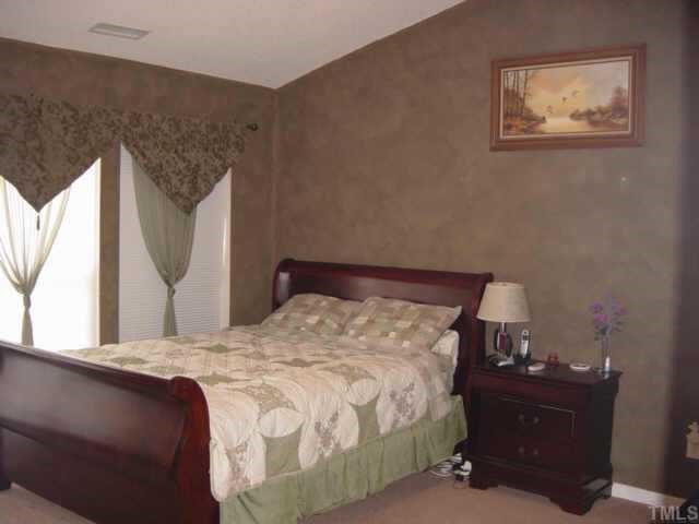 116 Saddle River Road Apex, NC 27502 - Photo 5 of 10 This generous master bedroom features cathedral ceilings with fan and plush, new carpet installed 1 year ago, plus a large, walk-in closet. Window treatments throughout home convey with property.