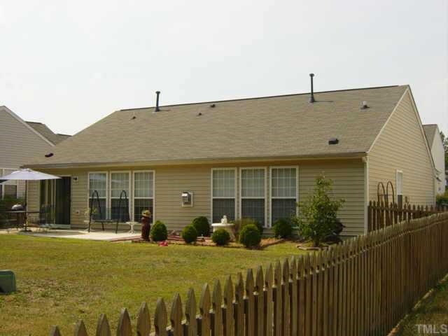 116 Saddle River Road Apex, NC 27502 - Photo 7 of 10 Home is low maintenance with vinyl siding and features a spacious level lot. Property has been well-maintained and nicely landscaped.