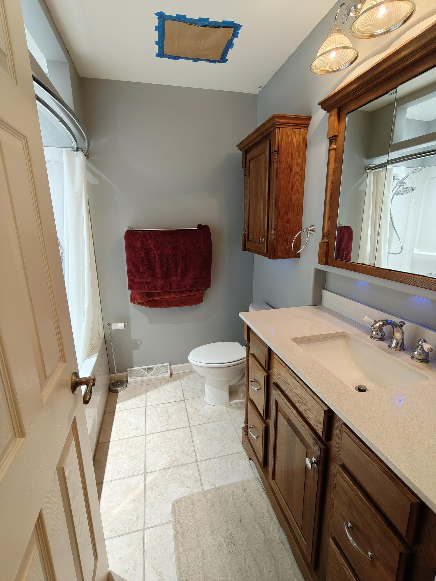 134 Elm Court Hebron, IN 46341 - Photo 11 of 36 a bathroom with a sink a toilet and mirror